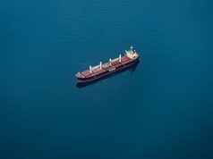 Hanwha Ocean FPSO Accident Leaves 5 Missing A large floating production storage and offloading ship under construction at a South Korean shipyard, with cranes and scaffolding around it.