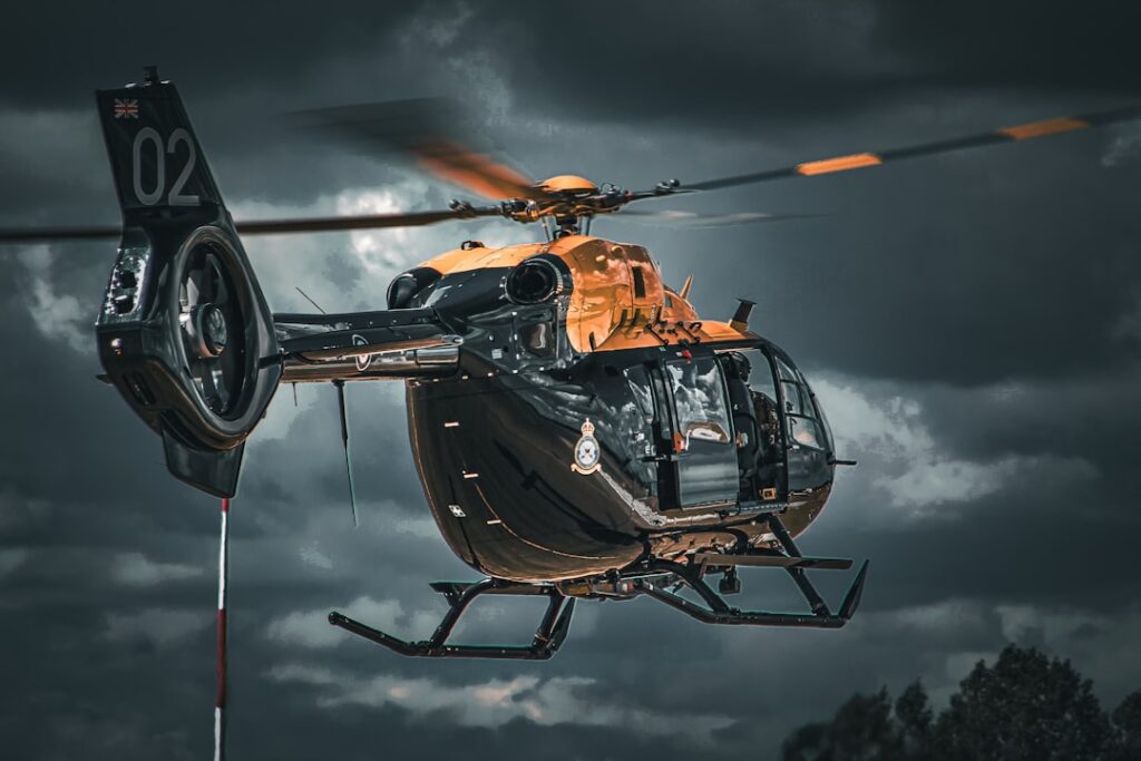 An Airbus EC135 helicopter similar to the crashed medical transport aircraft in flight over a Turkish landscape.