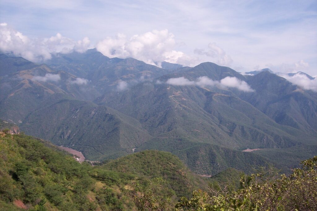 Mexican police and military personnel search rugged terrain near a mine in Sinaloa state for kidnapped workers.