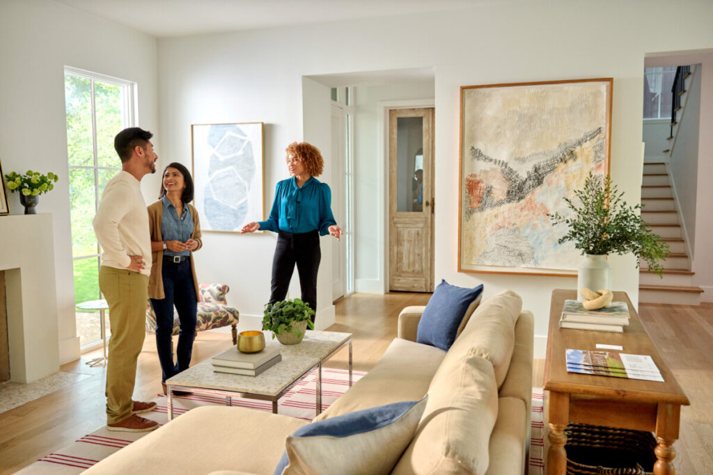 Home Buyers Touring A House For Sale
