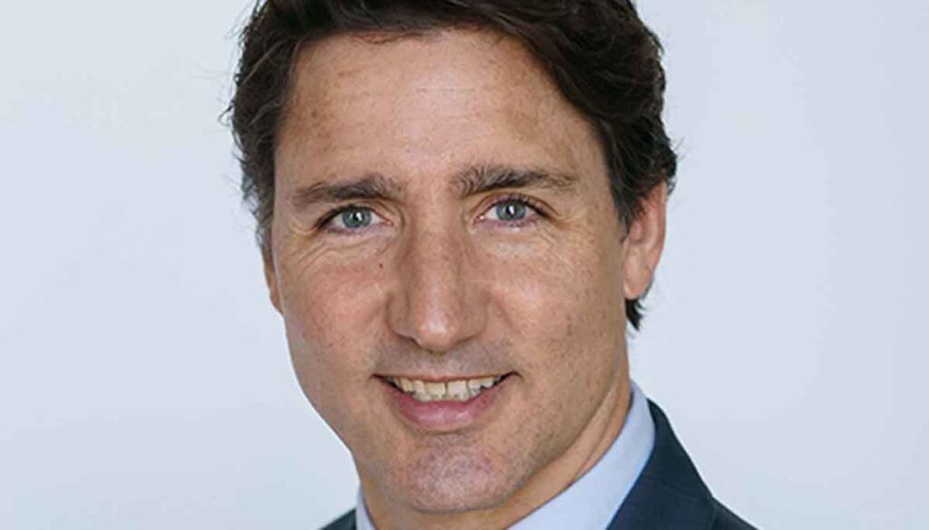 Justin Trudeau speaks at a podium in Toronto, announcing a political agreement with the New Democratic Party.